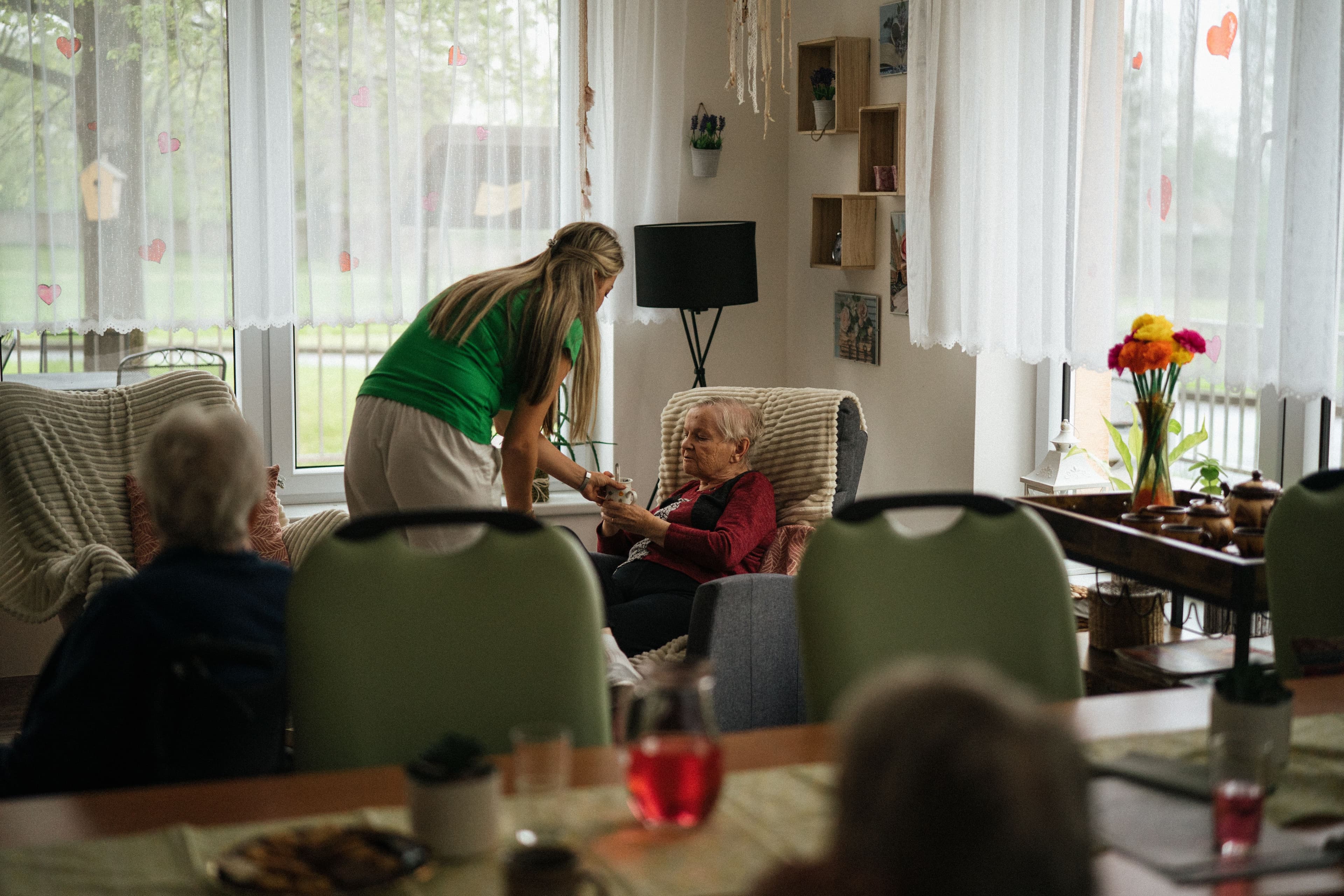 Caregiver reading with a senior client