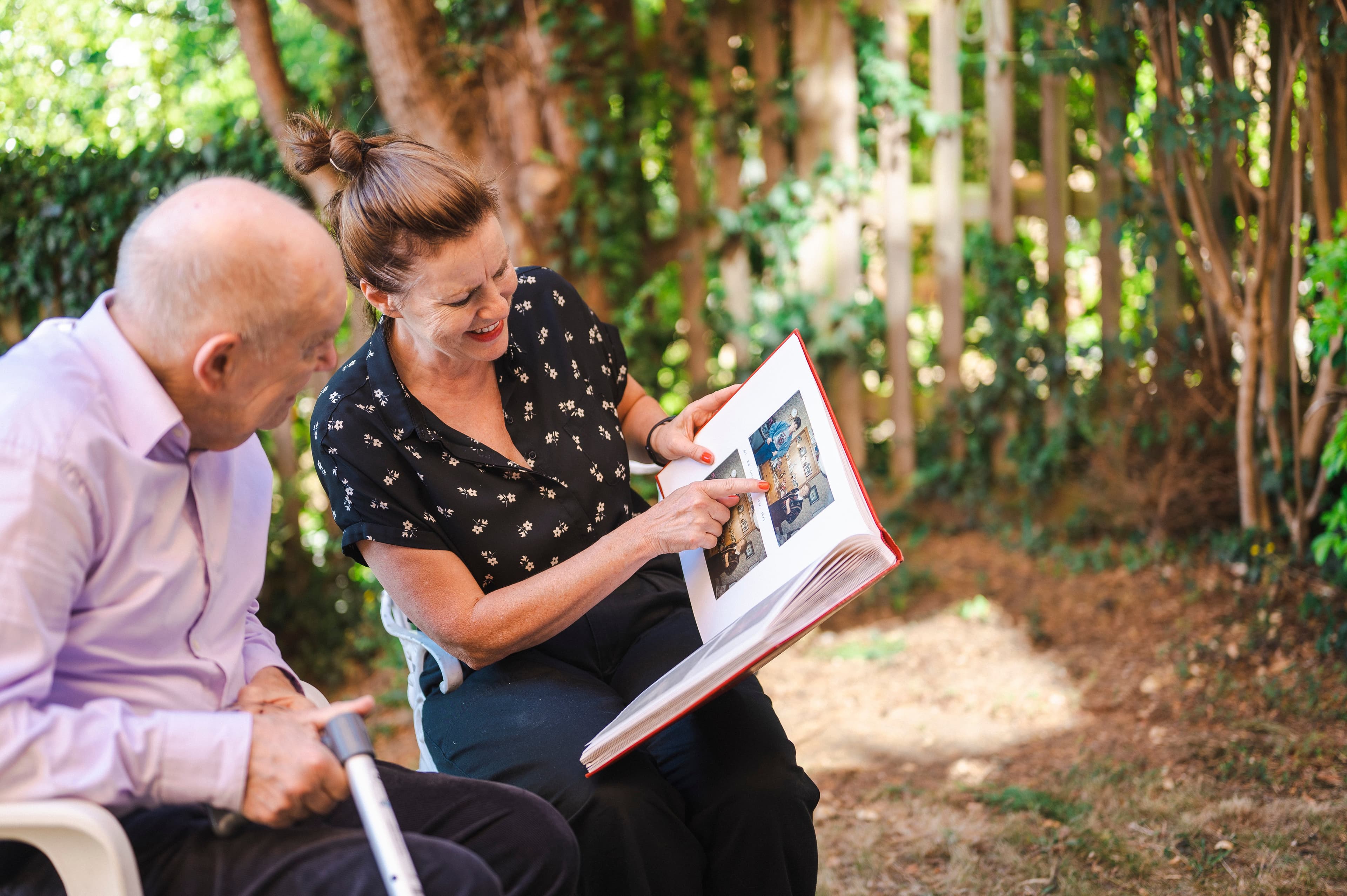 Compassionate Pavan caregiver embracing an elderly senior client with warmth