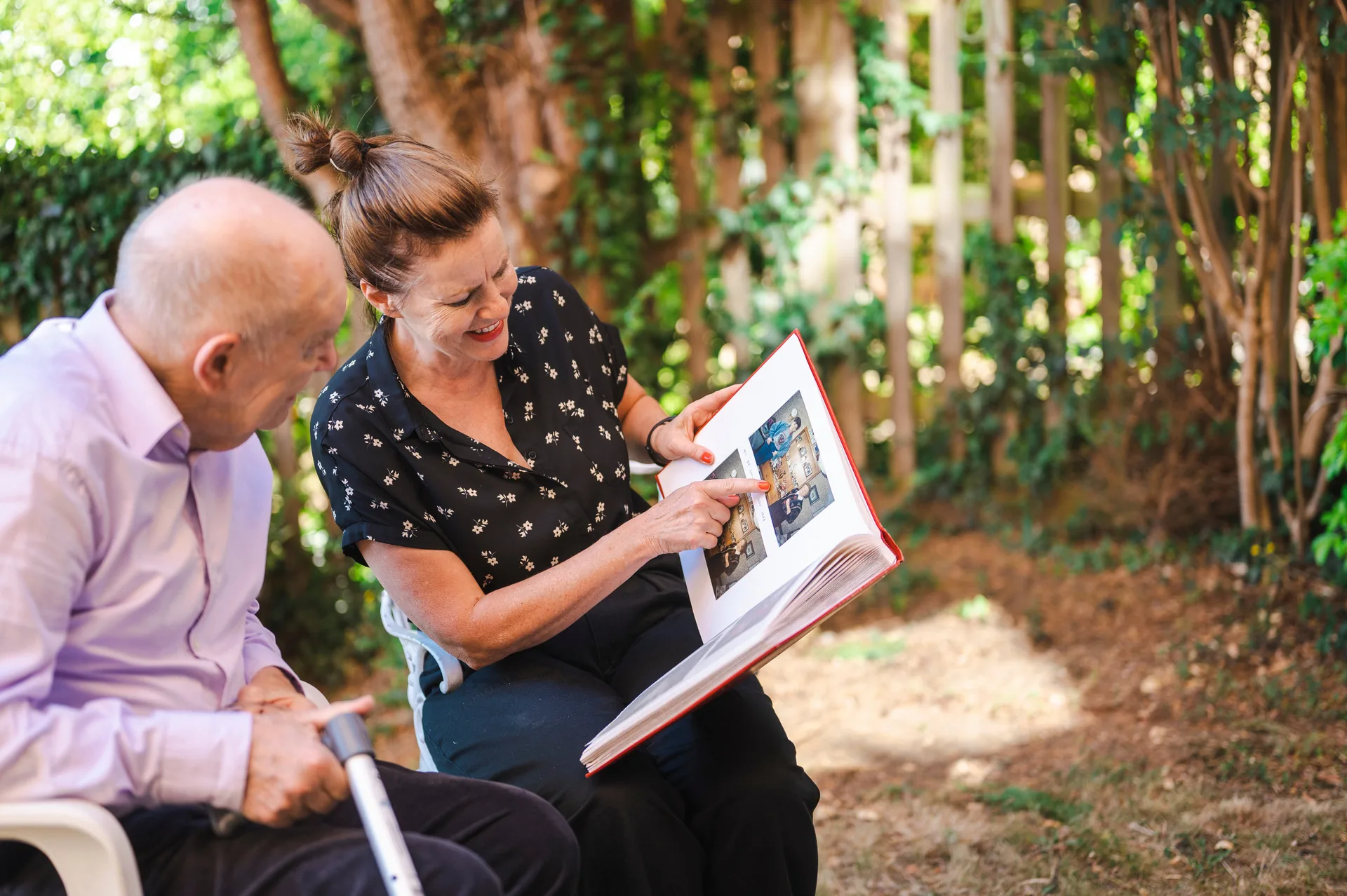 Compassionate Pavan caregiver embracing an elderly senior client with warmth